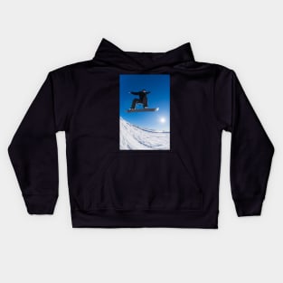 Snowboarder jumping against blue sky Kids Hoodie